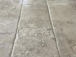 Montclair Hand-Finished Antiqued French Limestone Flooring in the cream, oyster and gray hues.