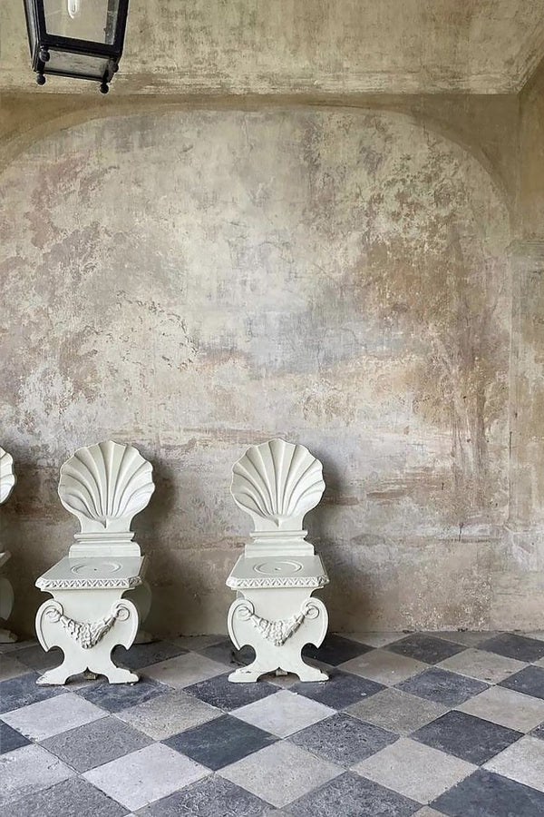Historic black and white checkerboard limestone flooring in European interior