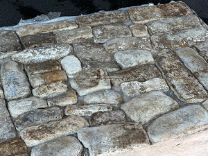 Imagine sitting in front of an antique French fireplace with these antique French limestone cobblestones underfoot.