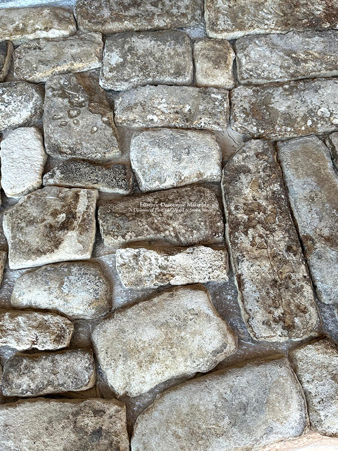 Courtyards and long corridors would be a handsome vestibule with these antique French cobblestones.