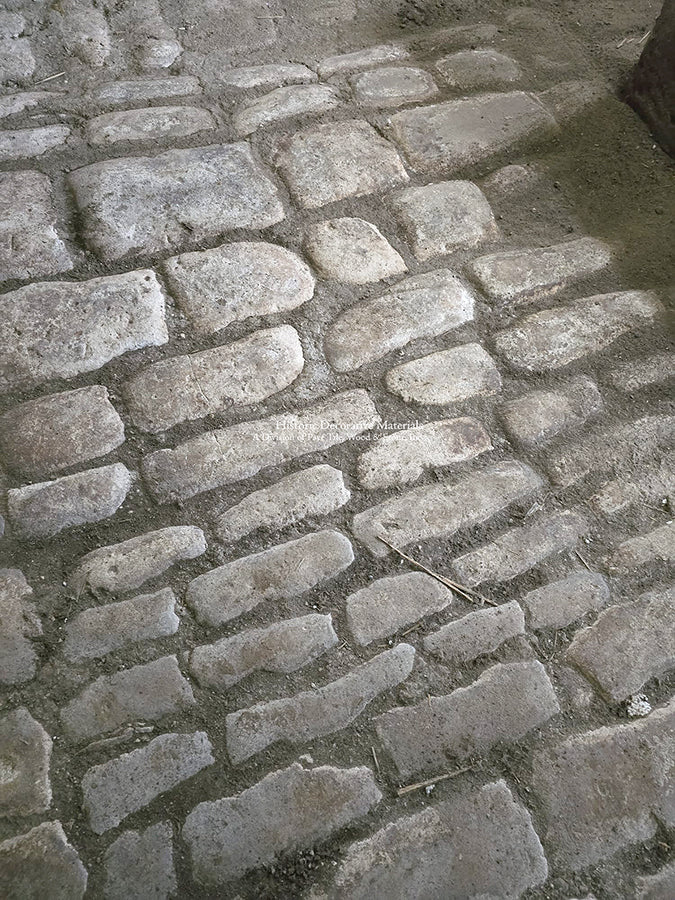 After cleaning, we revealed the magnificent patina and colors of these antique French limestone cobblestones.