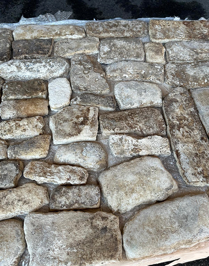 Squares, rectangles and thinner pavers create a marvelous historic mosaic of antique French limestone cobblestones.