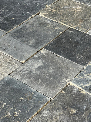 Pair cream and white colors with antique French oak floors when installing antique Belgian bluestone for a kitchen floor.