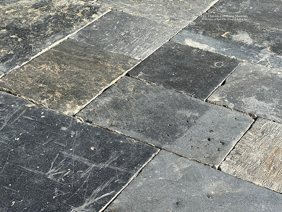 A cobblestone pattern from rectangles to squares adds incredible interest to antique Belgian bluestone floors.