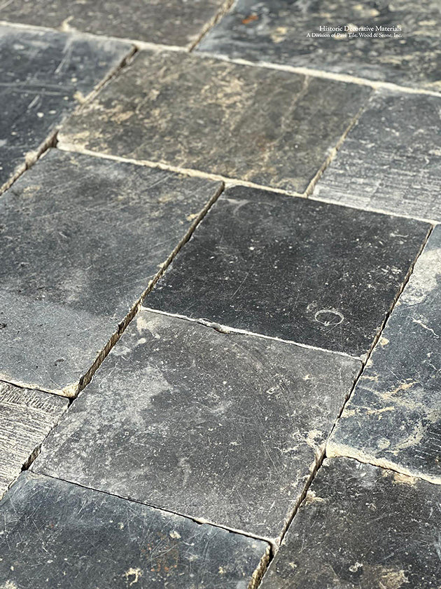 Hand chiseled to satin patina, the variety of surface textures of an antique Belgian bluestone floor is remarkable.