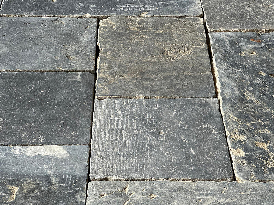 Installing antique Belgian bluestone for a kitchen floor creates an historically elegant interior.