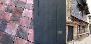 Antiqued Black French Oak Floors pair with reclaimed terra cotta and French limestone tiles.