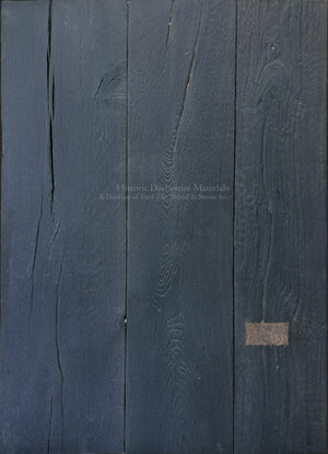 Handcrafted antiqued French oak wood flooring in deep black charcoal with rustic grain and historic patina