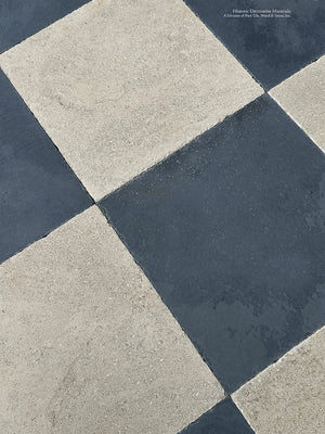 Antiqued French limestone and ardoise checkerboard tile floor with aged patina