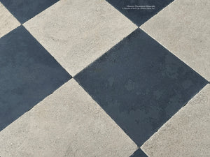 Antiqued checkerboard French limestone and ardoise flooring in grand entry hall