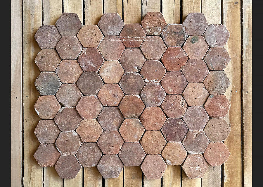 An amazing mosaic-like French reclaimed terra cotta tile hexagon is a rare gem to behold.