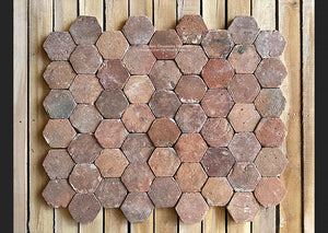 An amazing mosaic-like French reclaimed terra cotta tile hexagon is a rare gem to behold.