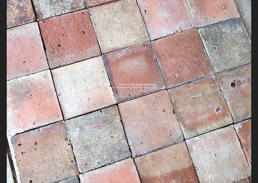 The quality of reclaimed French terra cotta tiles show in a tight grout line installation.