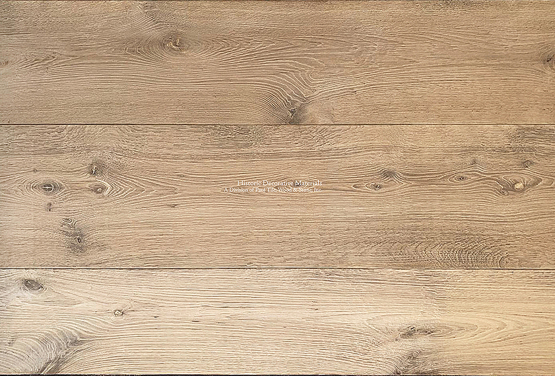 Reclaimed French Oak Floors in antiqued oak hue is perfect for country home kitchens.