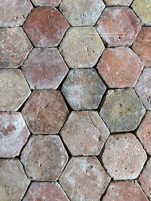 Olive green kitchen cabinets would love to share space with a French reclaimed terra cotta tile floor.