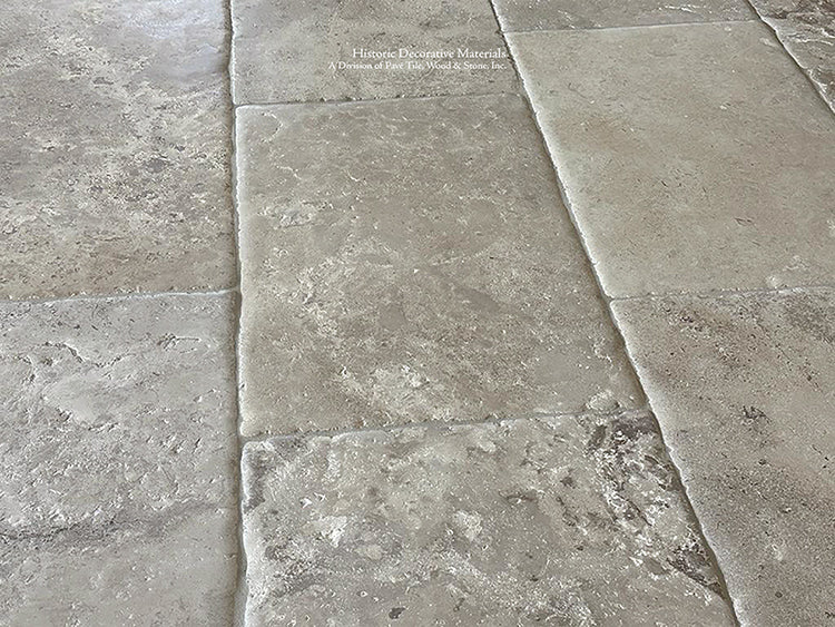 Montclair Hand-Finished Antiqued French Limestone Flooring in the cream, oyster and gray hues.