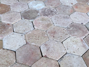 A light color palette of French reclaimed terra cotta tiles elevate elegance in a room's interior.