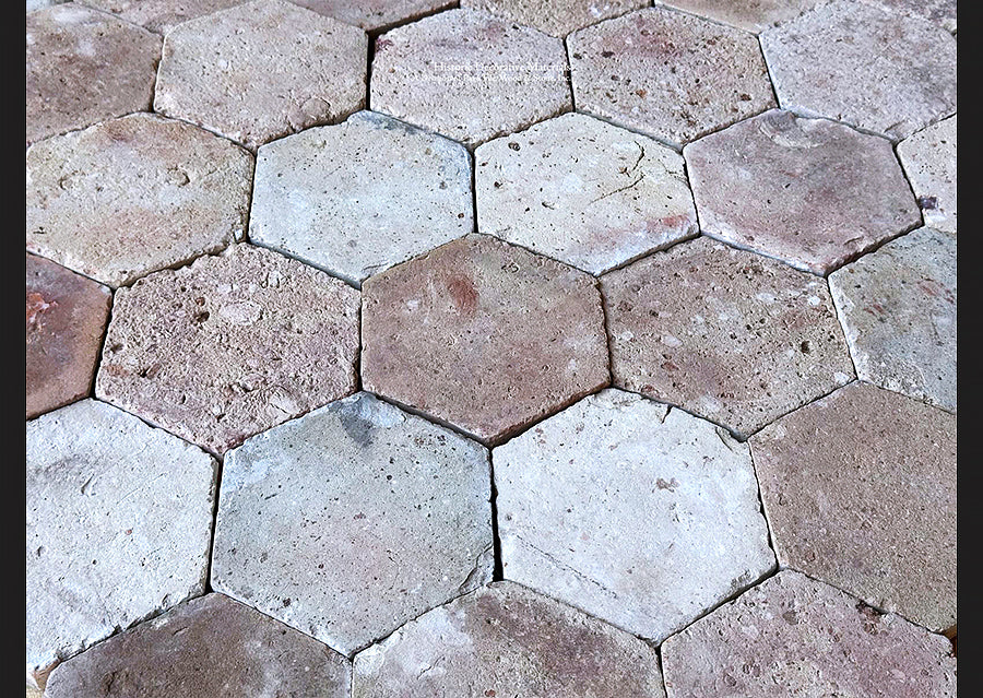 Antique French reclaimed hexagon terra cotta tiles salvaged from an old building in Paris.