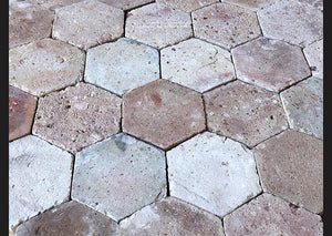 Antique French reclaimed hexagon terra cotta tiles salvaged from an old building in Paris.