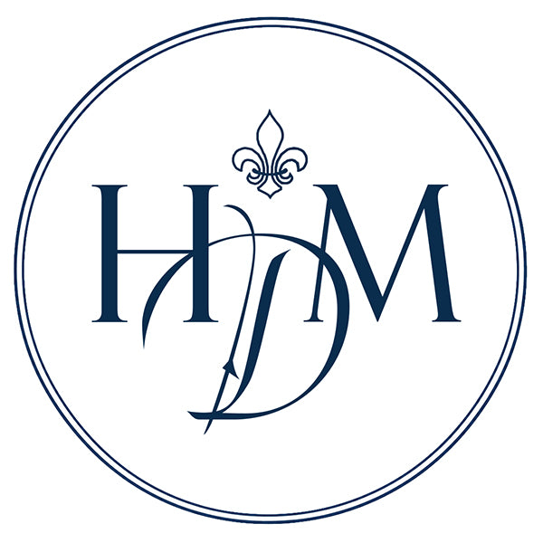 Monogram Logo Historic Decorative Materials suppliers of French oak floors, French limestone, terra cotta tiles, Belgian bluestone & Delft Tiles