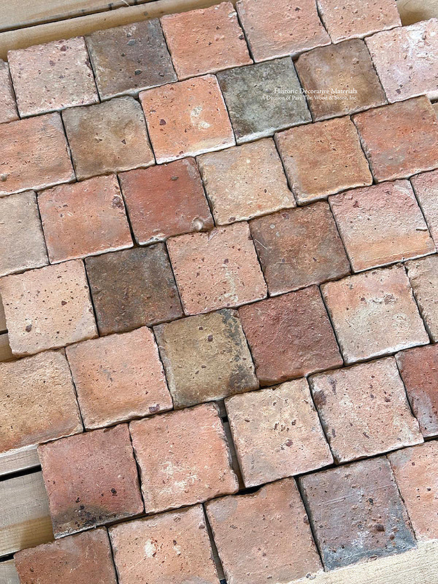 From blush and clay to olive, stone and gray - the colors of this antique French terra cotta tile cobblestone will add historic joy to a kitchen and dining room floor.
