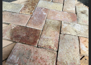 Provençal Antique French Terra Cotta Brick Tiles can be installed in a herringbone pattern.