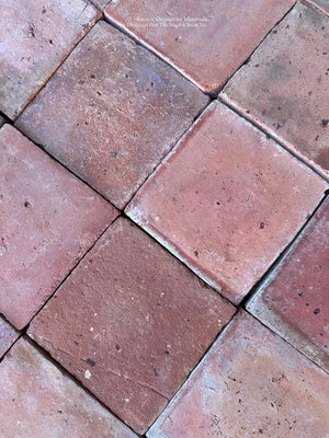 19th-century handmade French terra cotta tile with worn edges and authentic antique patina