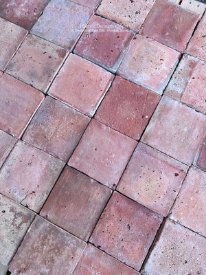 Antique French schoolhouse terra cotta flooring with handmade clay variation and aged patina