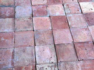 Old French terra cotta floor tiles with warm red rose salmon ochre and red-brown color variation