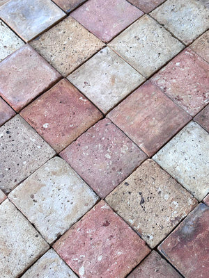 Reclaimed French terra cotta floor tiles with timeworn rose, warm buff and soft taupe clay patina