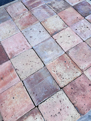 Authentic reclaimed French terra cotta tile with aged clay color variation
