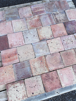 Reclaimed French farmhouse terra cotta flooring in rose red ochre and earth tones