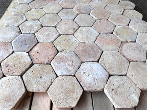 Reclaimed French terra cotta tile flooring paired with French oak and limestone interiors
