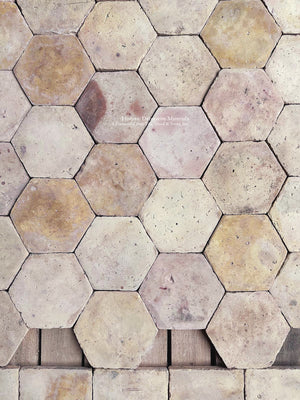 Authentic reclaimed French clay floor tiles with natural patina, gently worn edges and traditional hexagonal geometry.