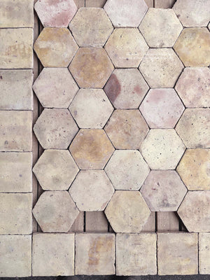 Reclaimed French hexagon floor tiles with historic European architectural character and softly weathered clay surfaces.