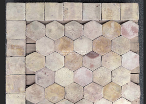 Reclaimed French terra cotta hexagon and square tiles in soft cream, faded rose and pale apricot with naturally aged clay patina.
