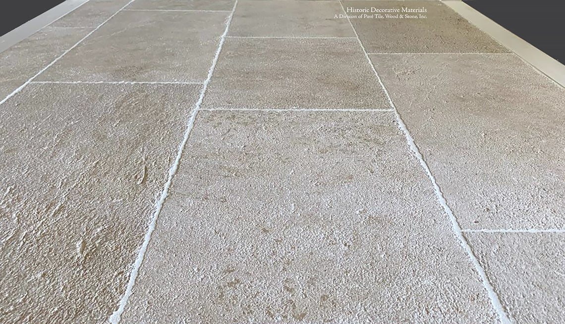 Wide pavers of Antique Blonde Barr French Limestone Flooring creates historic ambiance.