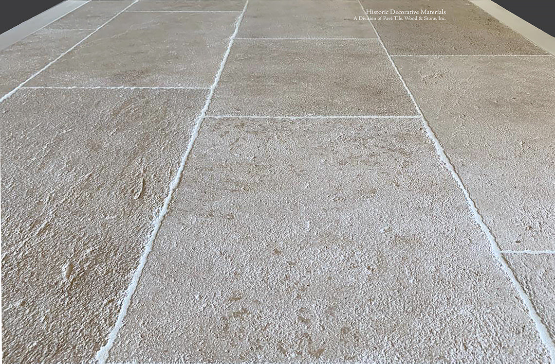 Wide pavers of Antique Blonde Barr French Limestone Flooring creates historic ambiance.
