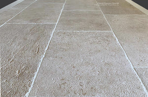 Wide pavers of Antique Blonde Barr French Limestone Flooring creates historic ambiance.