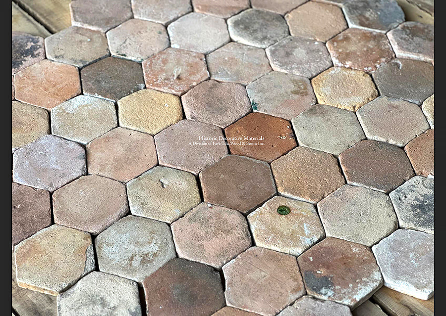 The multitude of terra cotta clay clays makes this cobblestone French reclaimed tile historic and joyful.