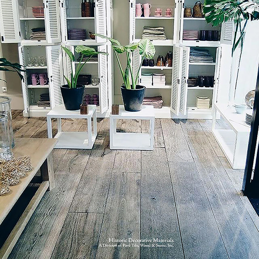 Aged weathered gray French oak flooring is splendid with white accents creating a crisp, historic contrast.