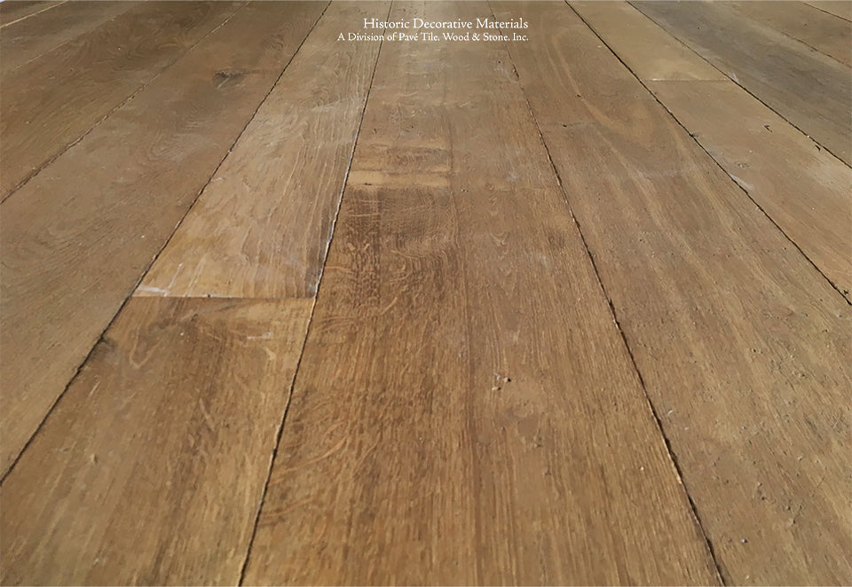 Hand-finished patina antiqued French reclaimed oak flooring creates historic authenticity. 