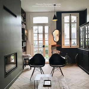 The warmth of a hardwood aged French oak floor in a natural patina paired with olive green walls brings the outside in.