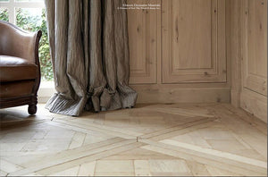 Refined interiors are heightened in beauty installing aged French oak flooring in parquet de Versailles panels