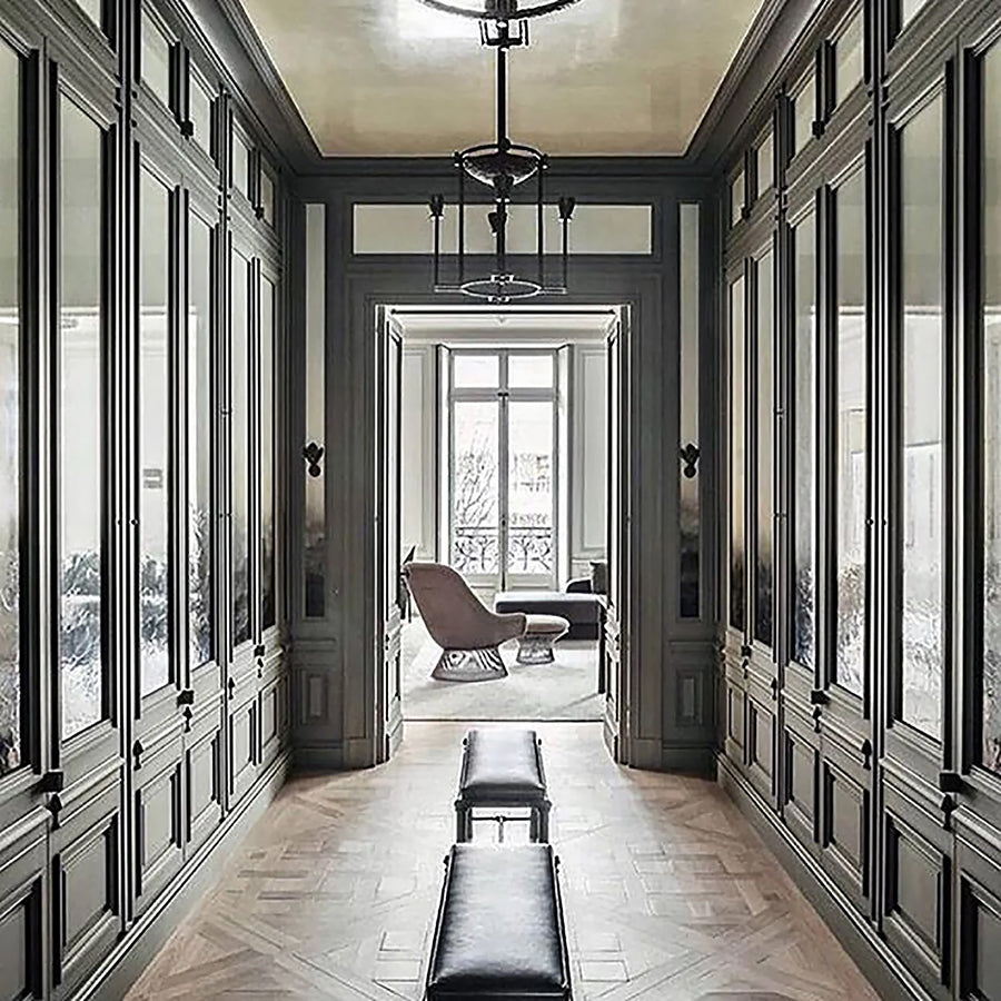 Aged French natural oak floors in a parquet de Versailles pattern is refined French elegance.