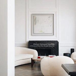 The satin patina of an aged French oak floor in herringbone pattern loves a cream, white and black decor.