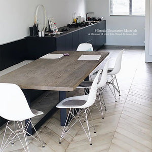 Minimalist interiors appreciate white aged French oak chevron pattern floor to add warmth and contrast to contemporary furnishings.