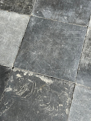 Hand painted kitchen cabinets and antique Belgian bluestone kitchen floors define timeless interiors.