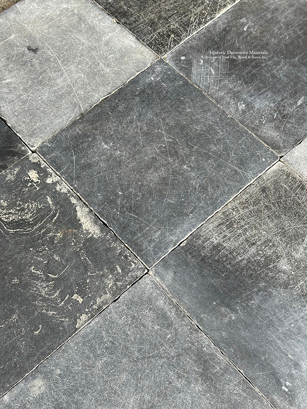Walk with history in your entryway installing antique Belgian bluestone flooring.