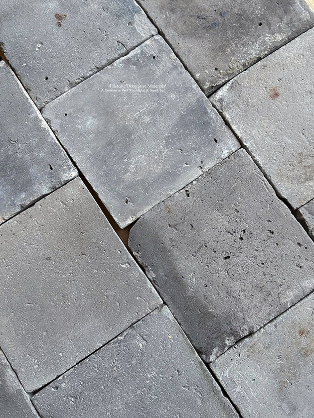 Salvaged gray-blue Dutch terra cotta tiles has a stone wash surface patina.
